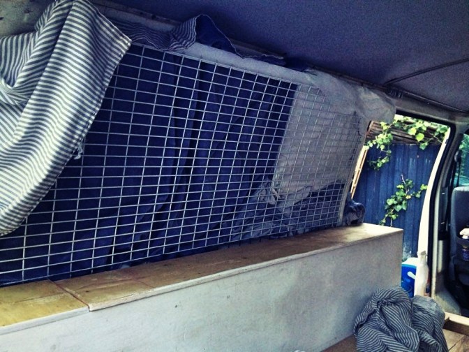 Spraying the cage inside Toyota HiAce campervan
